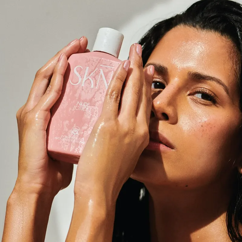 Nude lotion, pink bottle.